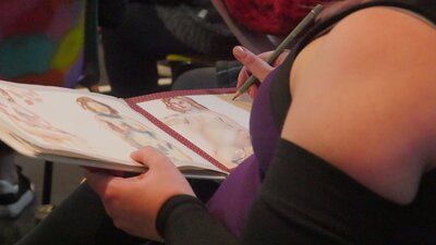 Photo of people creating life drawings