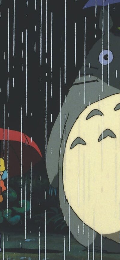 Animation of a young girl standing next to a large creature, both holding umbrellas for the rain