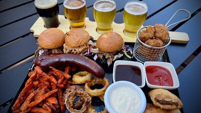 Smoked meats, burger sliders, beer paddles