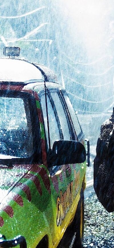 Dinosaur looking into a car