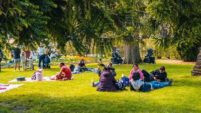 Visitors to Lanyon Homestead relax on the lawns during Floriade satellite site