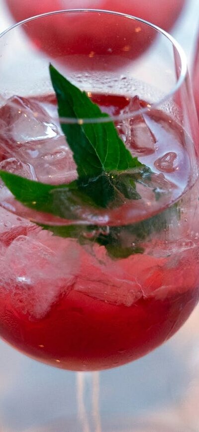 Pink cocktails with mint leave as decoration.