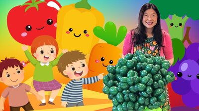 Dr Chloe Lim with a broccoli balloon sculpture for the Foodie Fun Play show 2026.