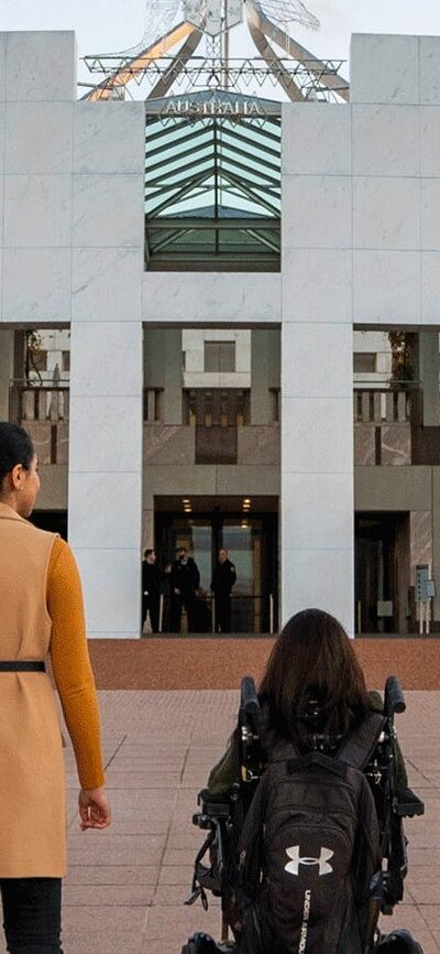 4 people in front of Parliament House.