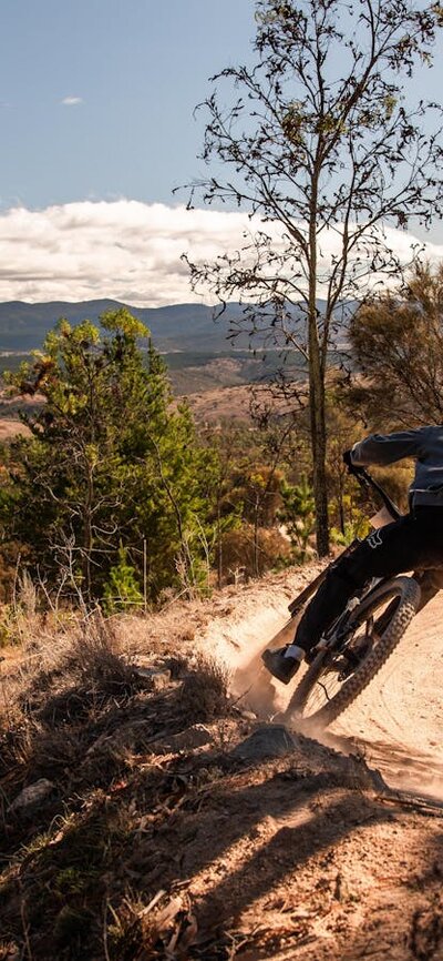 Racer in front of view from Stromlo into the Brindabellas
