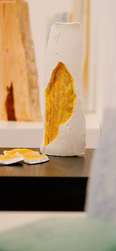 Several ceramic sculptures in a gallery
