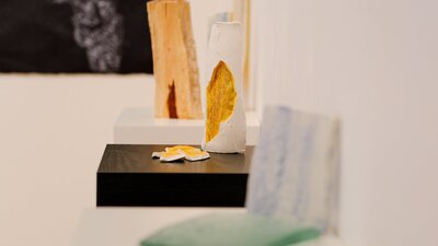 Several ceramic sculptures in a gallery