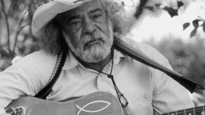B&W Singer-songwriter Bob Randall, with guitar.