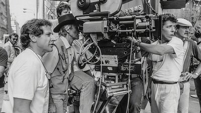 Black and white image of camera people all participating in shooting