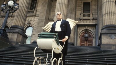 Pram Factory 1994 | Not Classified | 56 mins | AUS | D: Anna Grieve, James Manche Man walking down stairs pushing a pram wearing angel wings and a suit and bowtie