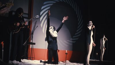 Three Directions in Australian Pop Music 1972 | Not Classified | 11 mins | AUS | D: Peter Weir Band on stage wearing black and white costumes with main singer on his knees