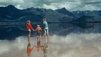 Wildness 2002 | Not Classified | 55 mins | AUS | D: Scott Millwood Three children holding hands standing in water with mountains in background