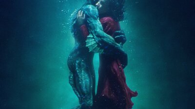 Merman and woman embracing under water