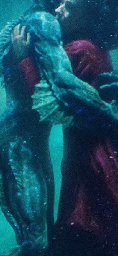 Merman and woman embracing under water