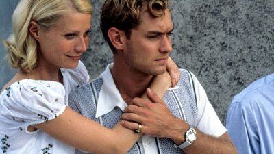 Woman with her arms around a man
