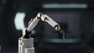 Close-up at a robotic arm's thin metal grip at its end.
