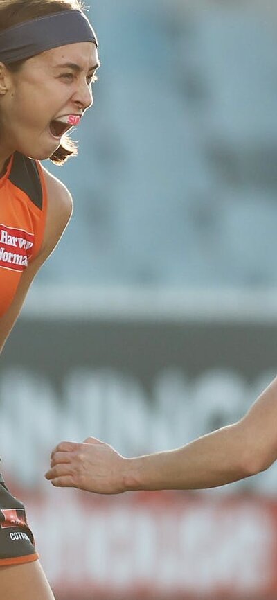 GIANTS AFLW players celebrate a goal at Manuka Oval