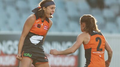 GIANTS AFLW players celebrate a goal at Manuka Oval