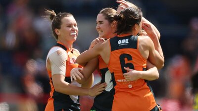 GIANTS AFLW team celebrate a goal