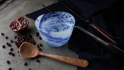 hand carved wooden spoon, and blown bowl