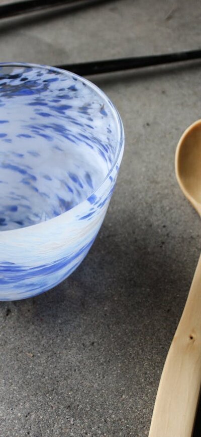 hand carved wooden spoon, and blown bowl