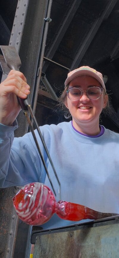 Make Your Own glassblowing class at Canberra Glassworks Participant glass blowing in MYO class
