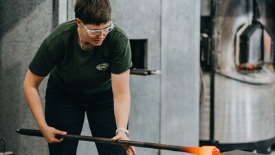 Artist blowing glass