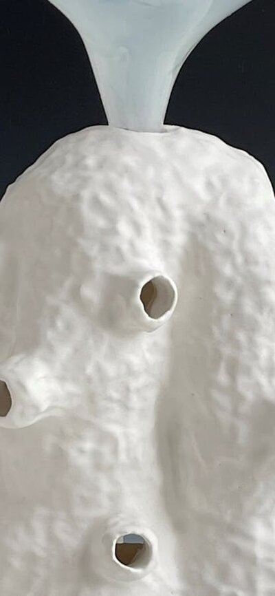 Lynda Draper artwork, made of glazed ceramic and studio blown glass, on grey background Lynda Draper artwork, made of glazed ceramic and studio blown glass, on grey background