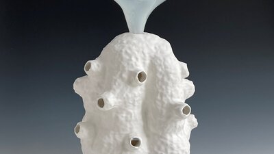 Lynda Draper artwork, made of glazed ceramic and studio blown glass, on grey background Lynda Draper artwork, made of glazed ceramic and studio blown glass, on grey background