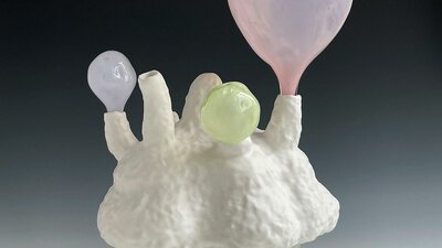 Lynda Draper artwork, made of glazed ceramic and studio blown glass, on grey background