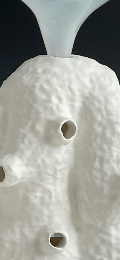 Lynda Draper artwork, made of glazed ceramic and studio blown glass, on grey background