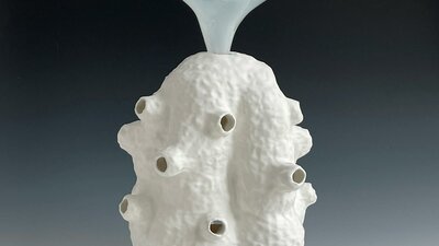 Lynda Draper artwork, made of glazed ceramic and studio blown glass, on grey background