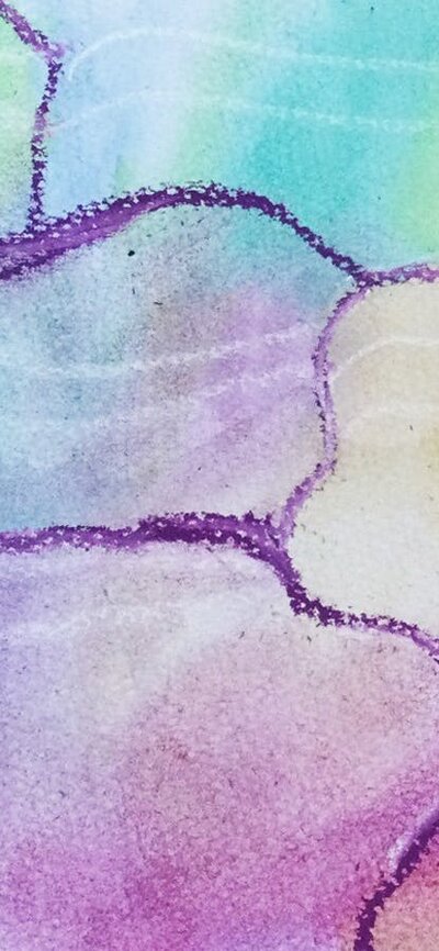 Kids hands working on a watercolour painting