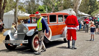 Santa and vintage classic car