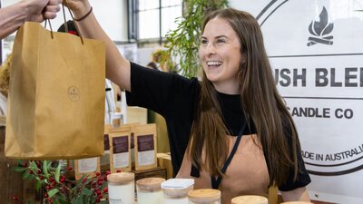 Bush Blend Candle Co handing bag to a customer