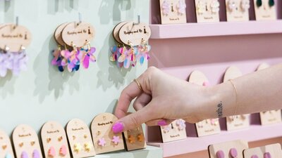 Customer picking Murphy and Me earrings