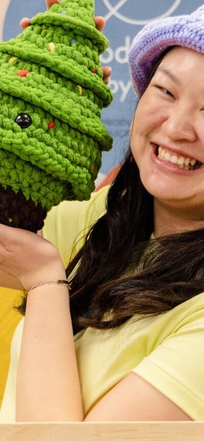 Productive by You holding a crochet Christmas tree
