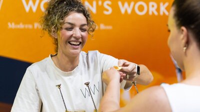 Women's Work serving a customer