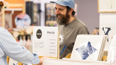 Eggpicnic talking to a customer