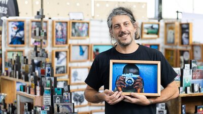 I Am Someone holding one of their photo blocks