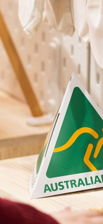 Australian Made green and gold logo on a stall at the market