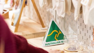Australian Made green and gold logo on a stall at the market