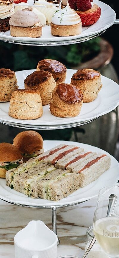 Close-up of high tea cake stand on table