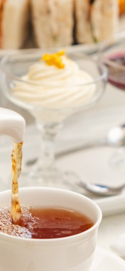 Pouring tea into cup