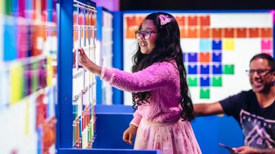 Child enjoying the Illuminate exhibition