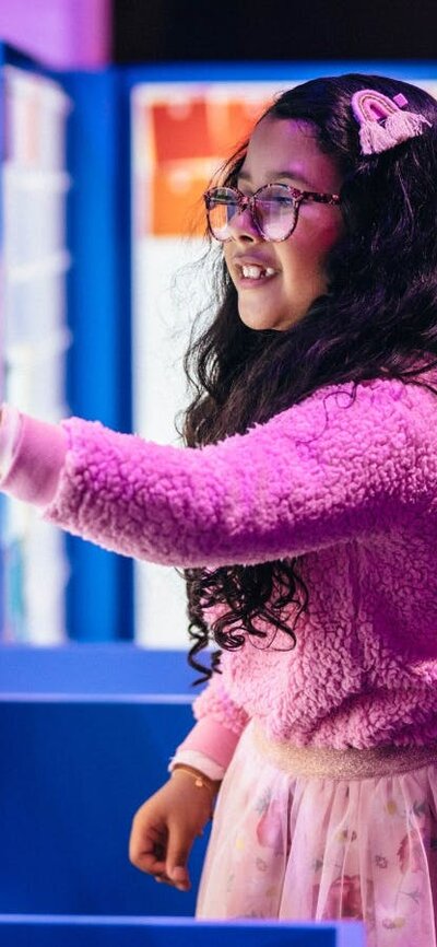 Child enjoying the Illuminate exhibition