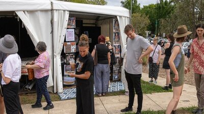 Attendees looking at artwork