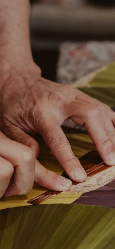 Inke Falkner using the technique of French straw marquetry on her artwork Round and Round