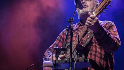 Don Morrison with his guitar performing