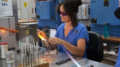 Artist Sarah Murphey flameworking at Canberra Glassworks Artist